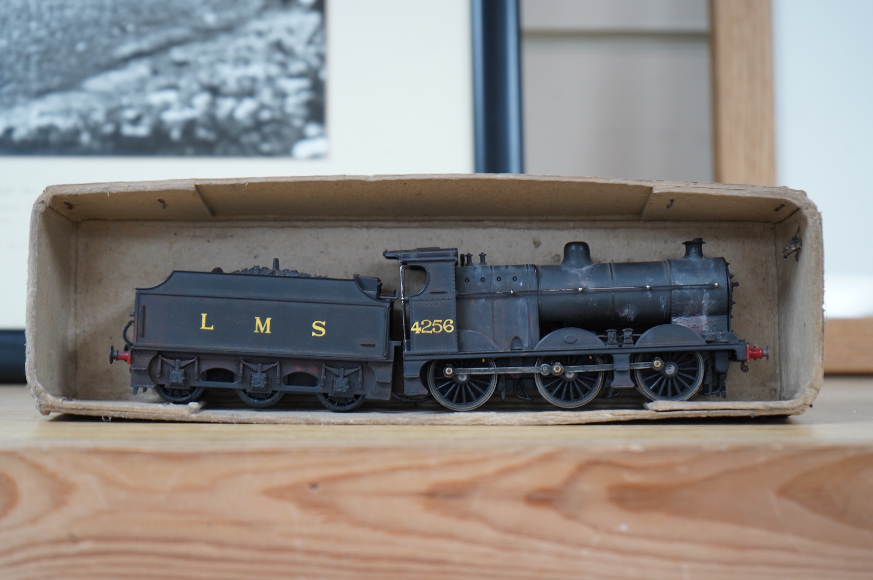 Two kit built and adapted EM gauge LMS railway locomotives; an 0-8-0, 9518, and an 0-6-0 class 4F based on an Airfix kit, together with the body only of an SR Schools Class